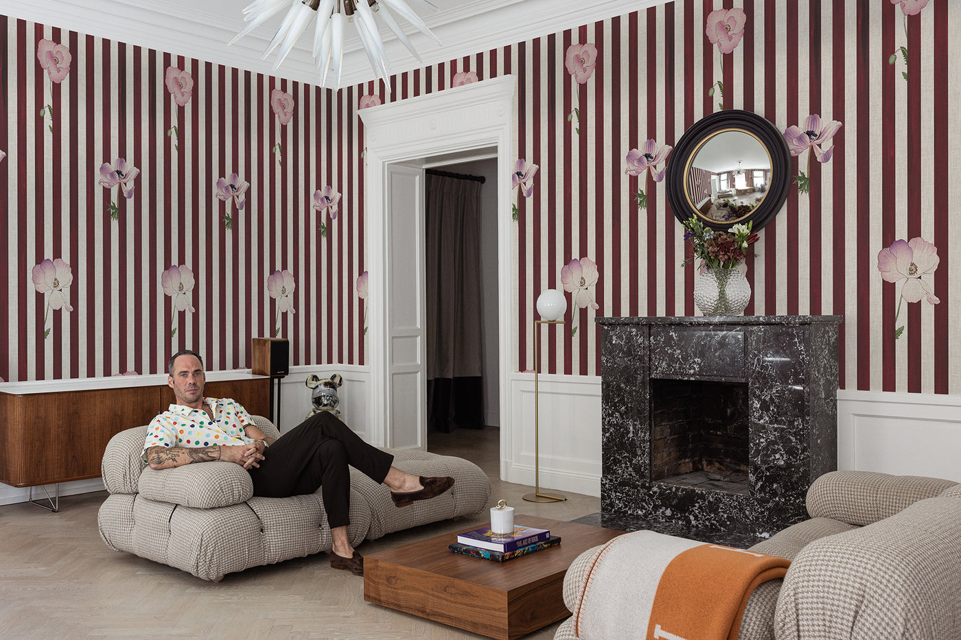 burgundy and white striped wall mural with pink flowers on the wall of the living room of Sebastian dollingers contempotary living 